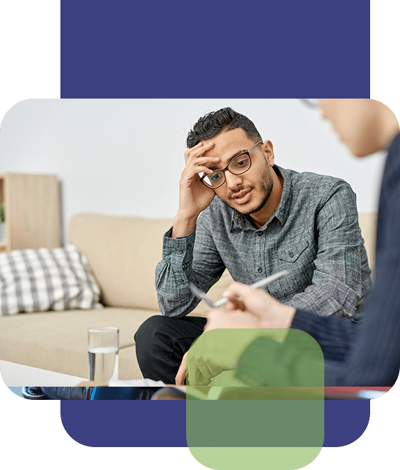 Man With Glasses Talking to Therapist